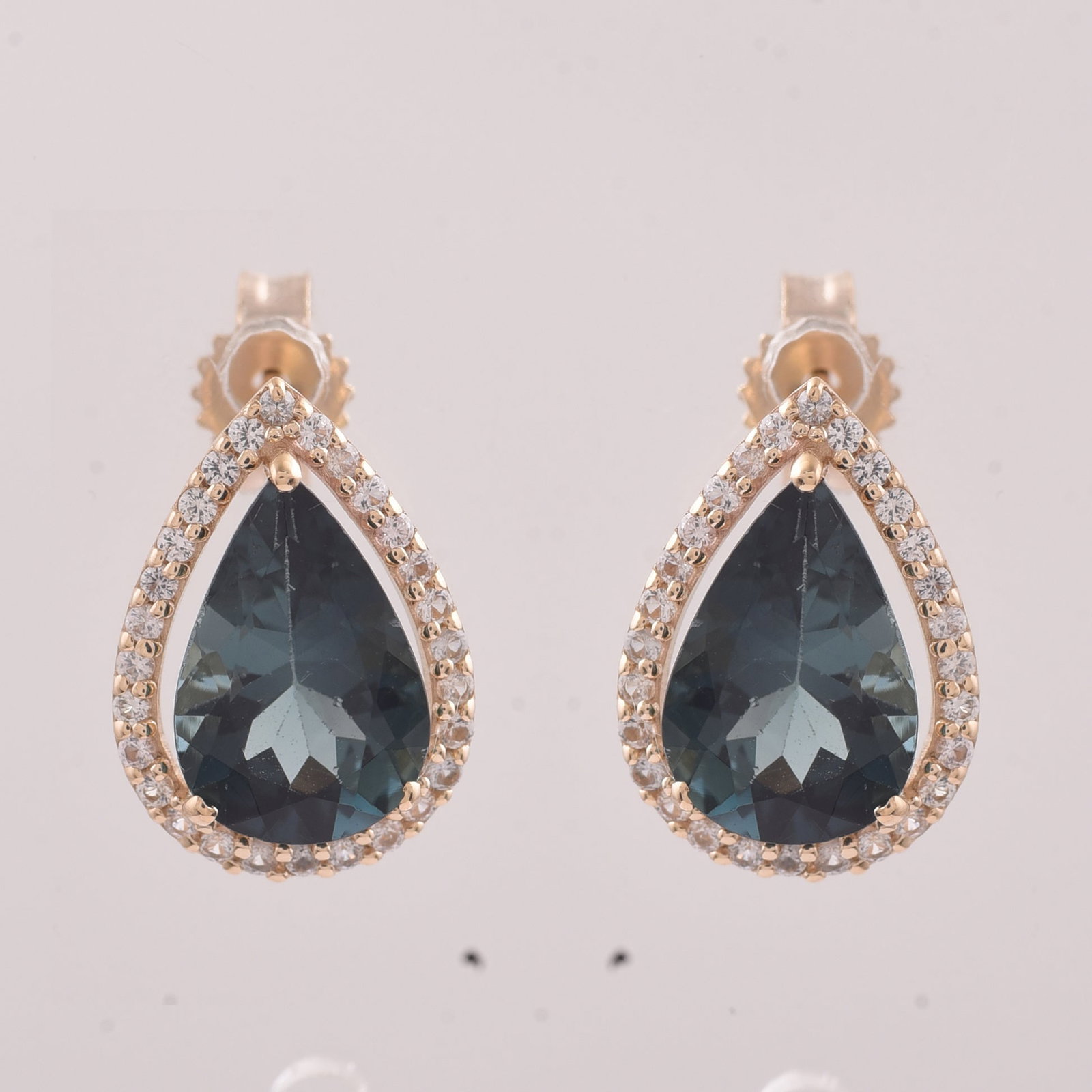 2.54 Ct Pear Tourmaline 9K Gold Earrings: 2.54 Total Carat Tourmaline 9K Gold Earrings Specifications: Total Weight 1.672 g Center Gemstone Tourmaline Gemstone Carat Weight 2.31 Carats Gemstone Measurements 9X6 mm Additional Gemstones White S