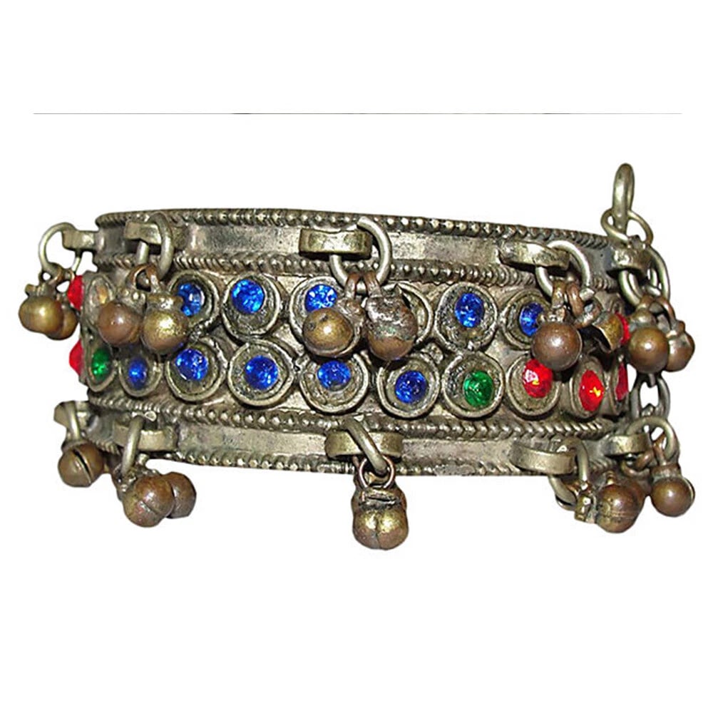 Afghani Hinge Glass Bell Bangle: Title:Afghani Hinge Glass Bell Bangle Description:1960s Afghani bangle adorned with colored glass and bell charms. Hinge and pin closure. Reserve: $87.00 Shipping: Domestic: Free shipping to anywhere 