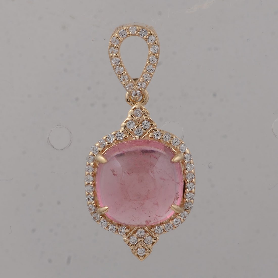 3.57 Ct Cushion Tourmaline 9K Gold Pendant: 3.57 Total Carat Tourmaline 9K Gold Pendant Specifications: Total Weight 1.75 g Center Gemstone Tourmaline Gemstone Carat Weight 3.36 Carats Gemstone Measurements 9X9X4.80 inch Additional Gemstones