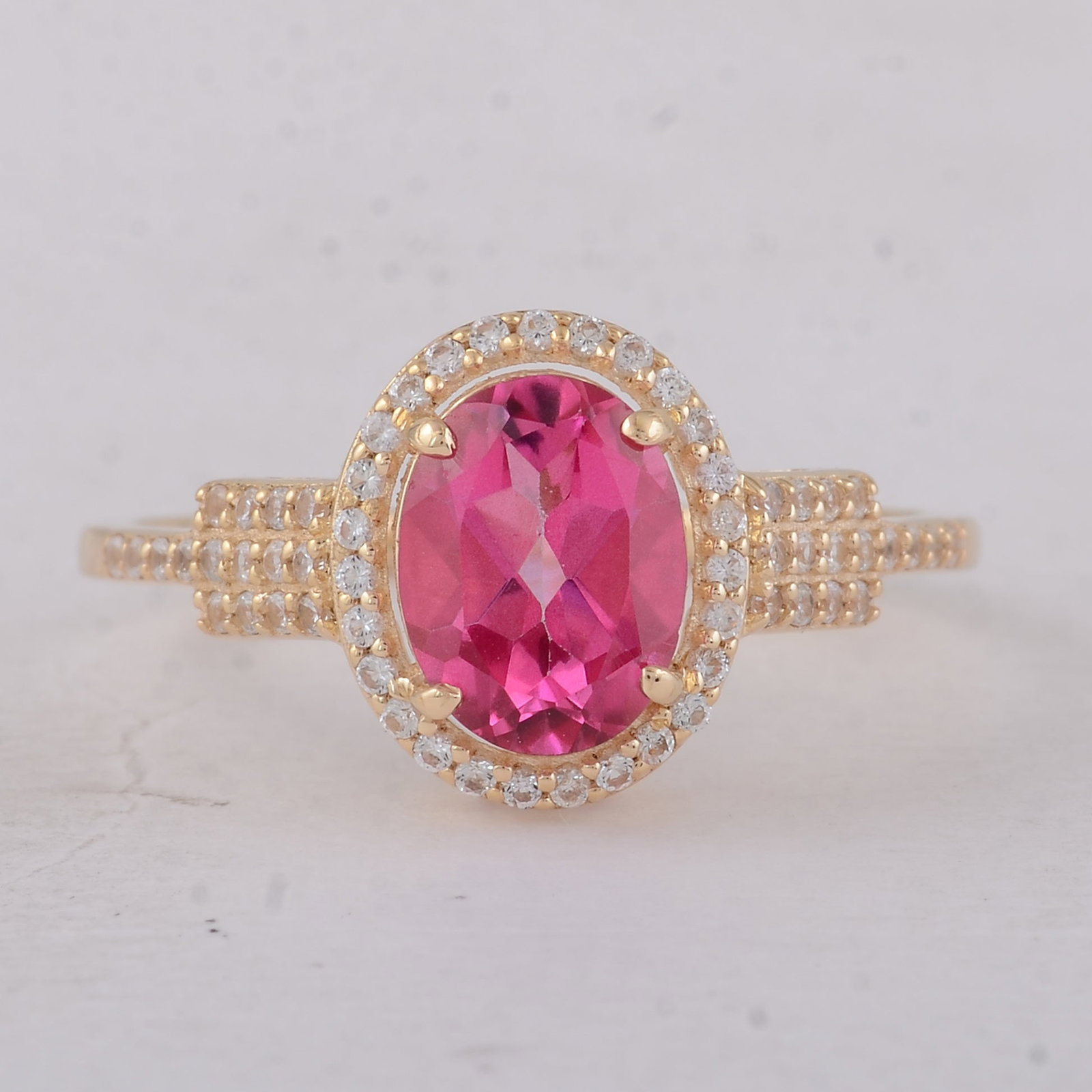 1.86 Ct Oval Pink Topaz 9K Gold Ring: 1.86 Total Carat Pink Topaz 9K Gold Ring Specifications: Total Weight 2 g Center Gemstone Pink Topaz Gemstone Carat Weight 1.59 Carats Gemstone Measurements 8X6 mm Additional Gemstones White Sapphire