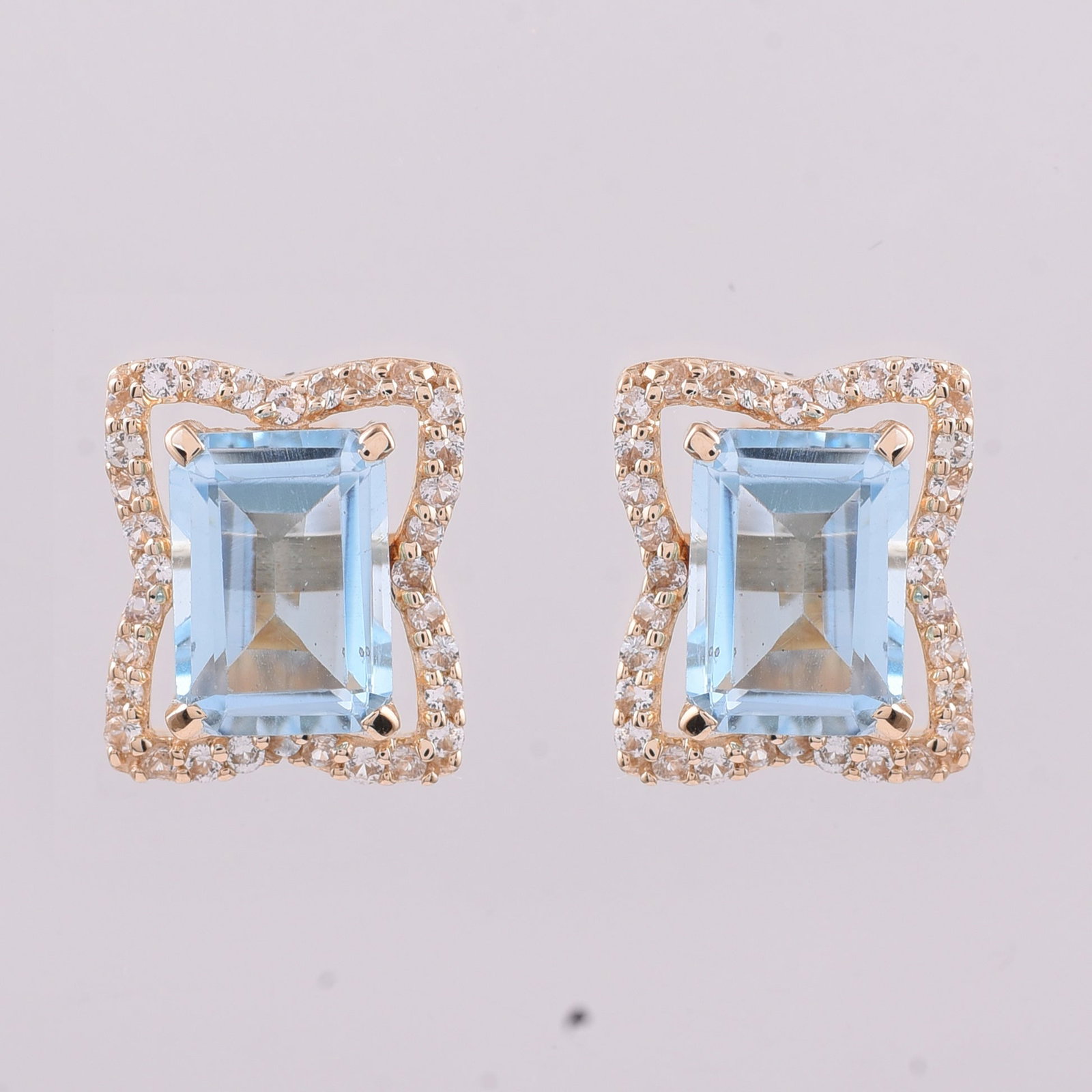 2.59 Ct Octagon Blue Topaz 9K Gold Earrings: 2.59 Total Carat Blue Topaz 9K Gold Earrings Specifications: Total Weight 1.931 g Center Gemstone Blue Topaz Gemstone Carat Weight 2.3 Carats Gemstone Measurements 7X5 mm Additional Gemstones White Sa