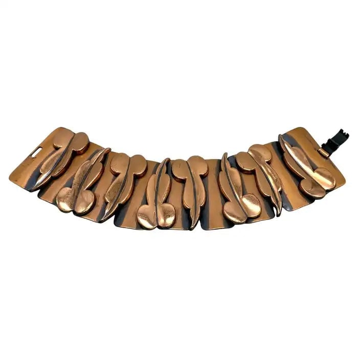 Renoir Copper Link Bracelet: Title: Renoir Copper Link Bracelet Description: This is a 1950s Renoir of California copper bracelet. Nine panels link with eight stylized leaves. The artificially added dark patina gives greater visu