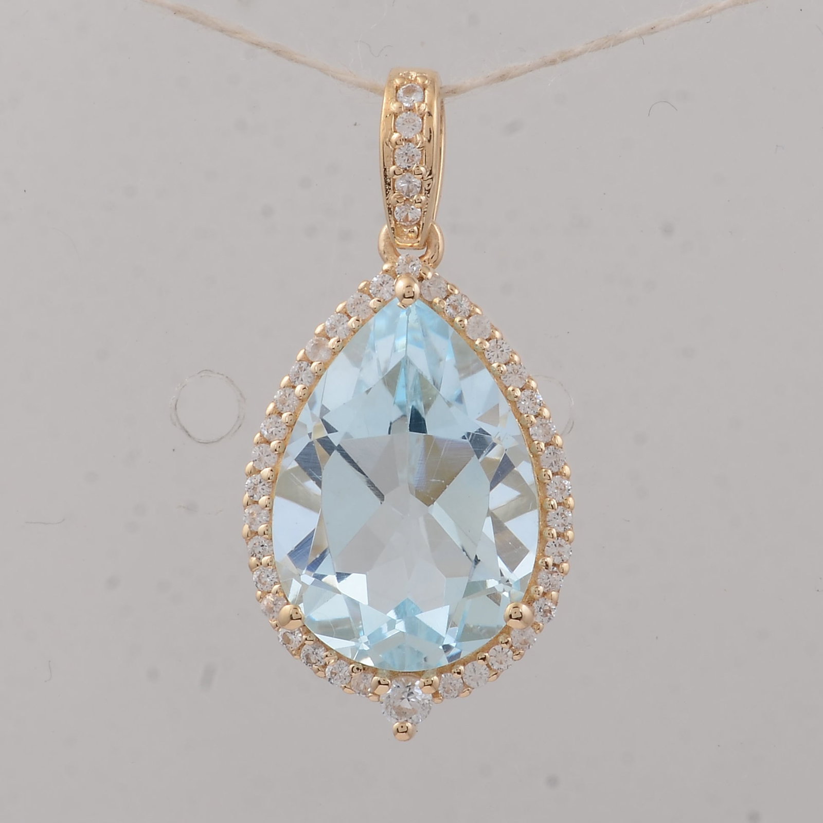 4.11 Ct Pear Aquamarine 9K Gold Pendant: 4.11 Total Carat Aquamarine 9K Gold Pendant Specifications: Total Weight 1.95 g Center Gemstone Aquamarine Gemstone Carat Weight 3.91 Carats Gemstone Measurements 13.20X9.20X6 mm Additional Gemstones 
