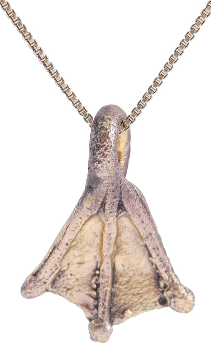 ANCIENT VIKING SORCERER'S AMULET 10TH-11TH CENTURY AD: Just under 1" (0.98") in height. Bronze shaped as a duck's foot and intricately detailed and especially well delineated. A burial at Viden, Denmark contained the body of a woman of wealth and status b