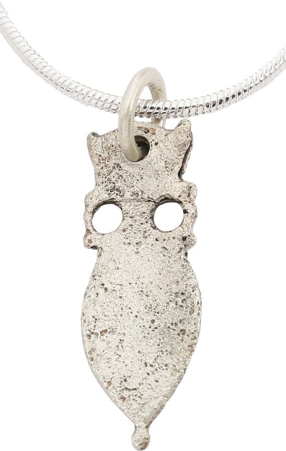 EUROPEAN WOMAN's NECKLACE PENDANT C.1250-1450: Silvered bronze, over 7/8" height. Of armorial form, possibly representing "Greek fire" which would indicate Crusaders among the forebears. These are thought to represent the targets at which knights 