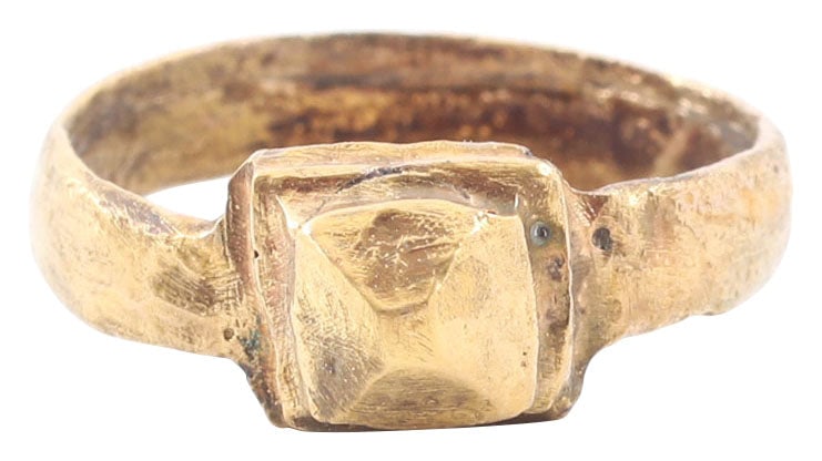 ROMAN PROSTITUTE’S RING 1ST-3RD CENTURY AD, SIZE 7 1/2: Size 7 1/2. 4.2mm rounded face band, flaring to the shoulders and topped with garnish pyramidal form bezel, comically emulating the stone of the quality rings worn by cultured women. Wear from extende