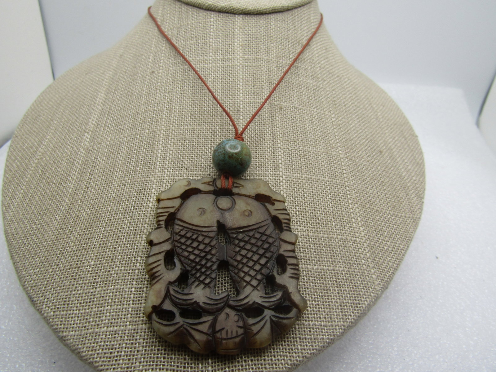 Vintage Carved Double Fish Necklace, 27", 1980's-1990's: Title: Vintage Carved Double Fish Necklace, 27", 1980's-1990's Description: Vintage Carved Double Fish Necklace, 27", 1980's-1990's. the stone is testing as jade/jadeite. It has a wash over it to make