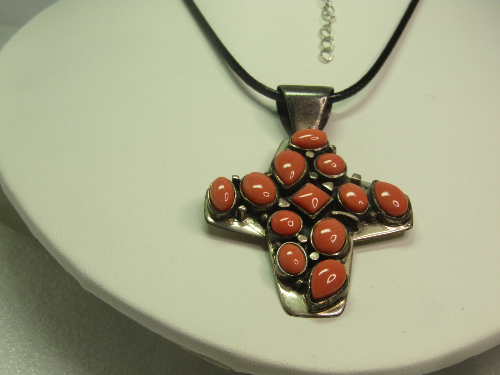 Sterling Coral Cross Pendant, Jay King, 24" Black Cord Necklace: Title: Sterling Coral Cross Pendant, Jay King, 24" Black Cord Necklace Description: Sterling Coral Cross Pendant, Jay King, 24" Black Cord Necklace. Mod Southwestern appeal. The cross is sterling