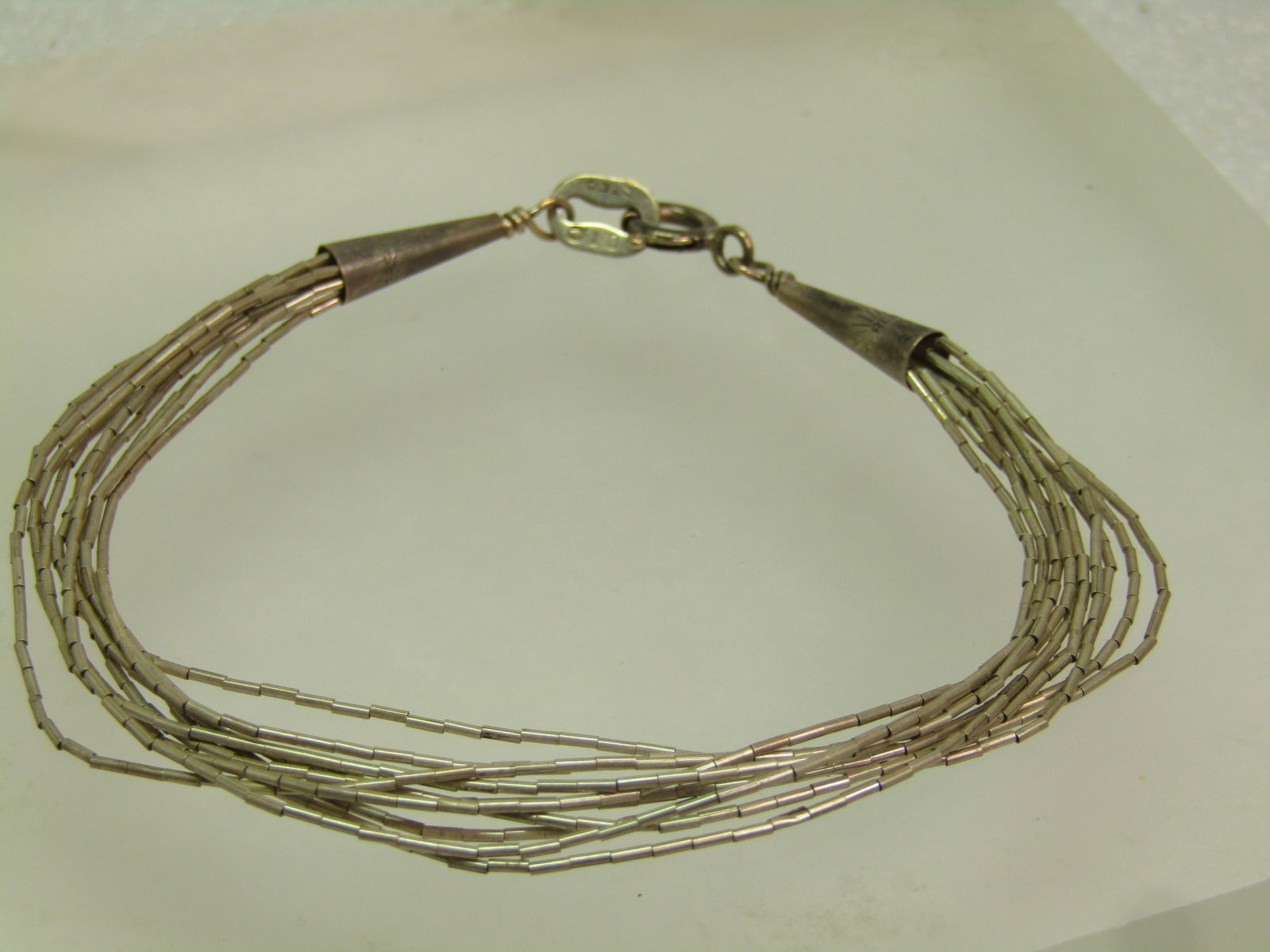 Vintage Sterling Southwestern Liquid Silver Bracelet, 10 Strands, 7.25" Signed Q.T. 1990's: Title: Vintage Sterling Southwestern Liquid Silver Bracelet, 10 Strands, 7.25" Signed Q.T. 1990's Description: Vintage Sterling Southwestern Liquid Silver Bracelet, 10 Strands, Signed Q.T. 1990's. Q. 