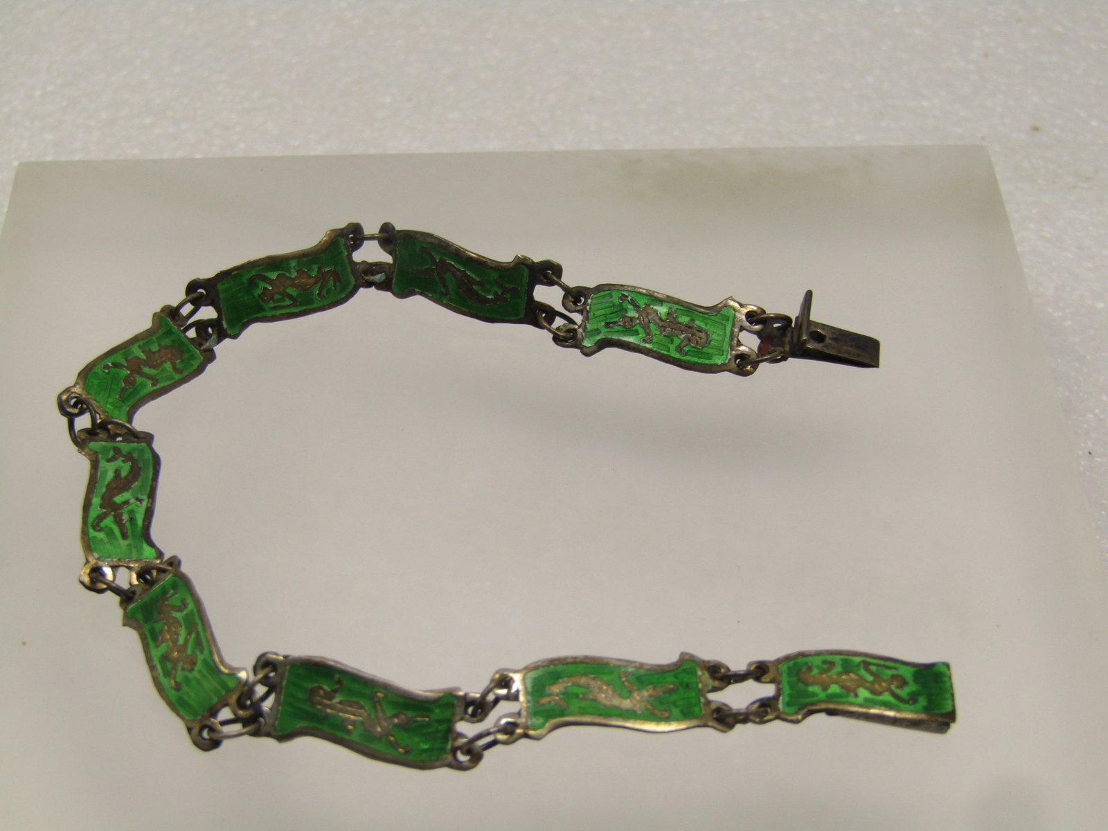 Vintage Sterling Siam Goddess Bracelet, Green Enameled Links, 7.25" 1930's-1960's: Title: Vintage Sterling Siam Goddess Bracelet, Green Enameled Links, 7.25" 1930's-1960's Description: Vintage Sterling Siam Goddess Bracelet, Green Enameled Links, 7.25" . It is appx. 7mm wide. 1930's