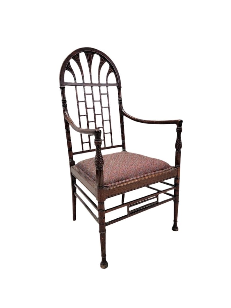 Antique American Aesthetic Carved Mahogany Armchair: Title: Antique American Aesthetic Carved Mahogany Armchair Description: .Antique American Aesthetic Carved Mahogany Armchair This antique American mahogany armchair has been aesthetically carved in an