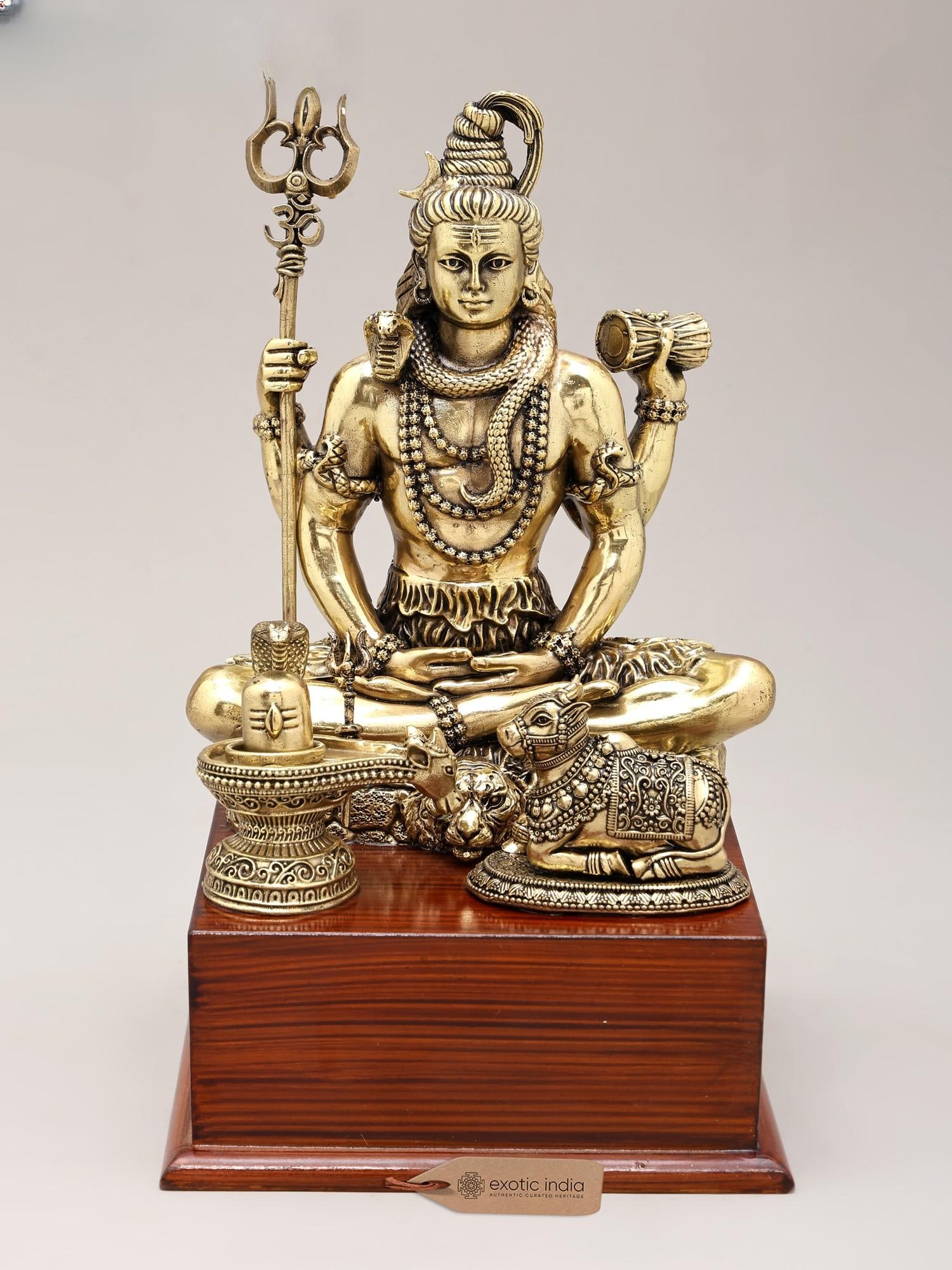 9" Brass Superfine Lord Shiva with Nandi and Shivalinga on Wood Base: Title: 9" Brass Superfine Lord Shiva with Nandi and Shivalinga on Wood Base Reserve: $248.00 Shipping: Domestic: Shipping rates are determined by destination International: Foreign shipping rates are 