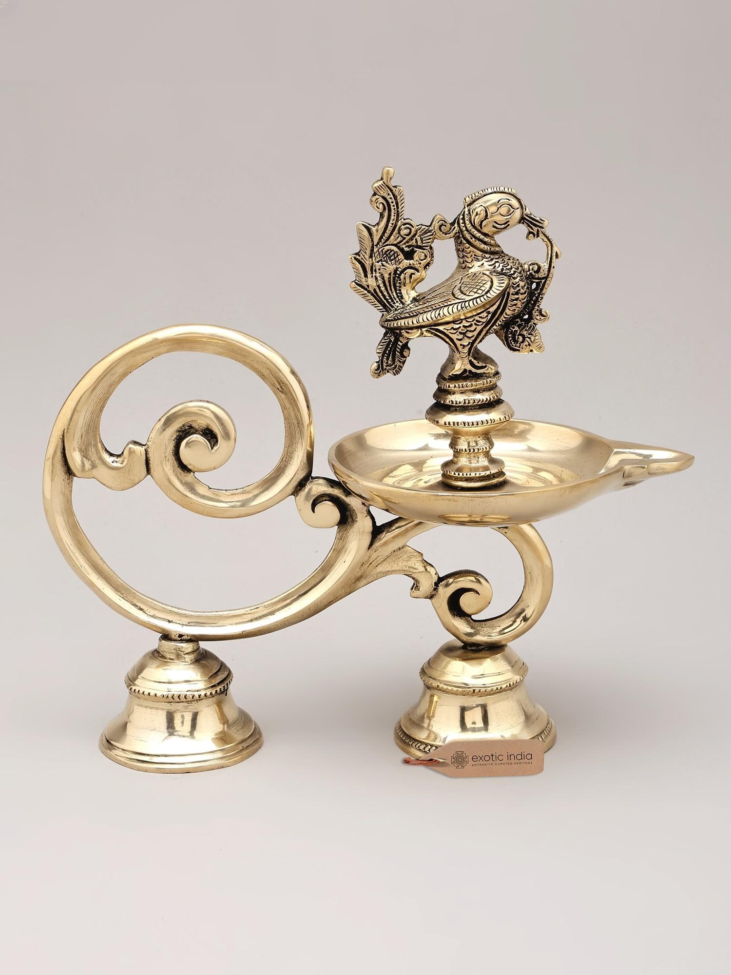 9" Brass Handheld Peacock Lamp: Title: 9" Brass Handheld Peacock Lamp Reserve: $98.00 Shipping: Domestic: Shipping rates are determined by destination International: Foreign shipping rates are determined by destination. Internationa