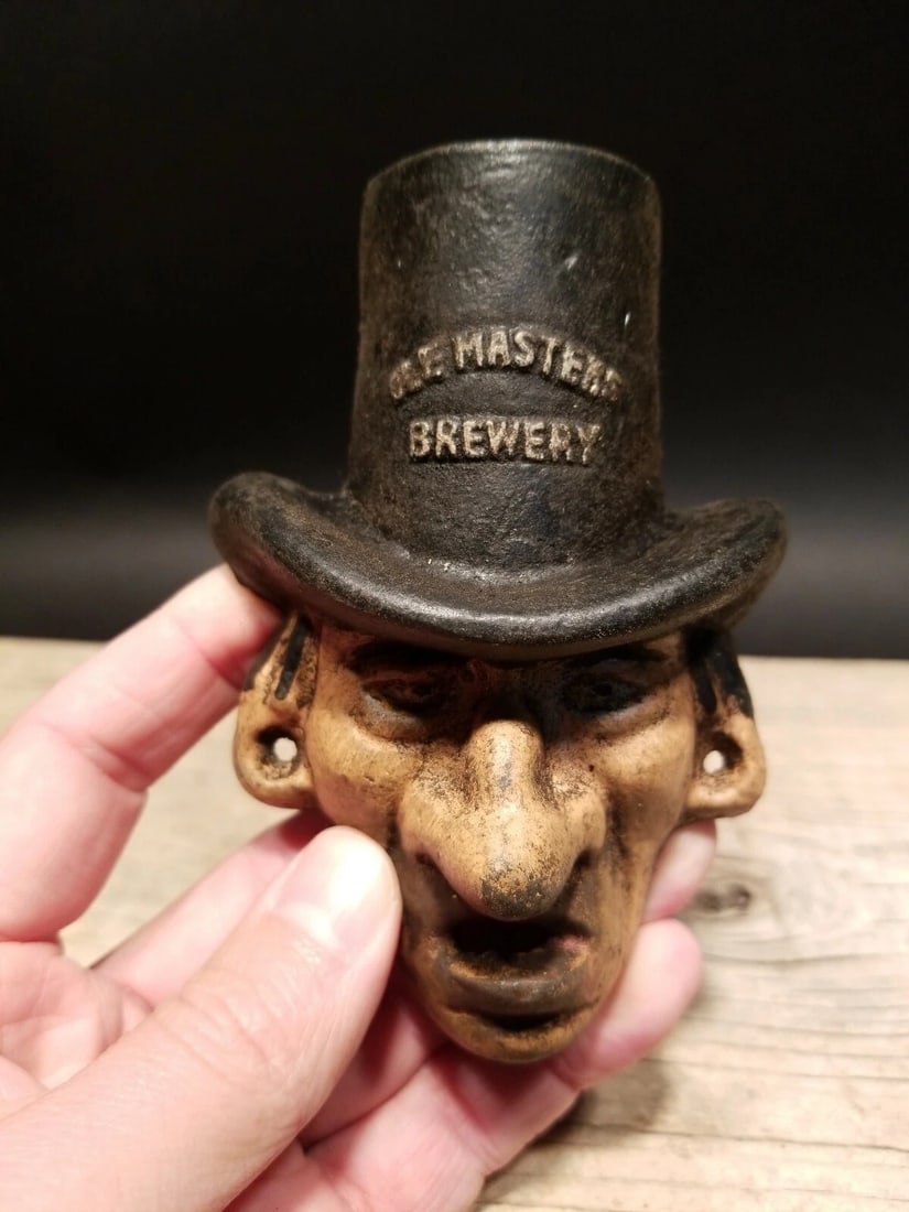 Cast Iron Ole Masters Brewery Beer Bottle Opener: 3 5/8" Tall x 3 1/2" Wide Great reproduction cast iron bottle opener. This piece was made to look just like an antique, but is new. Reserve: $18.00 Shipping: Domestic: Flat-rate of $5.00 to anywhere w