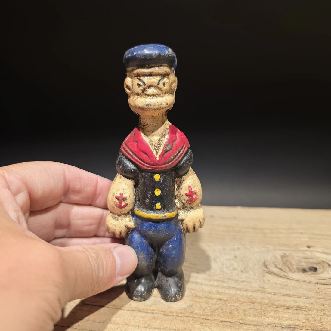 Cast Iron Saylor Coin Bank: 5 1/4" Reproduction cast iron coin bank featuring a sailor character. Figural banks like this were popular in the early to mid-20th century, combining character design with everyday use. Solid cast ir