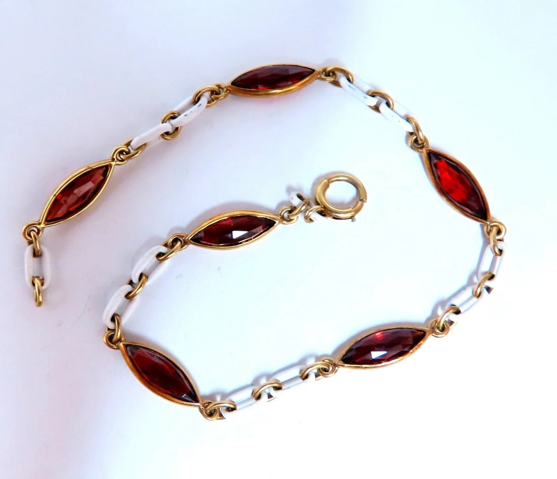 3ct Natural Garnet Station Link Bracelet 14kt gold *v: Title: 3ct Natural Garnet Station Link Bracelet 14kt gold *v Description: 3ct. Natural Garnets yard link bracelet. 9 x 4mm Caliber 7 Inches long. 14kt. yellow gold. 5.8 Grams. Reserve: $698.00
