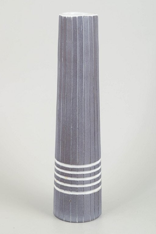 Ingrid Atterberg for Upsala-Ekeby, Sweden. Large cylindrical stoneware vase white horizontal ring: Ingrid Atterberg for Upsala-Ekeby Vase "Vinga", 1960s. Large cylindrical stoneware vase with vertical carved grooves and white horizontal ring decorations. Signed to the base, model 2219. Origin: Swed