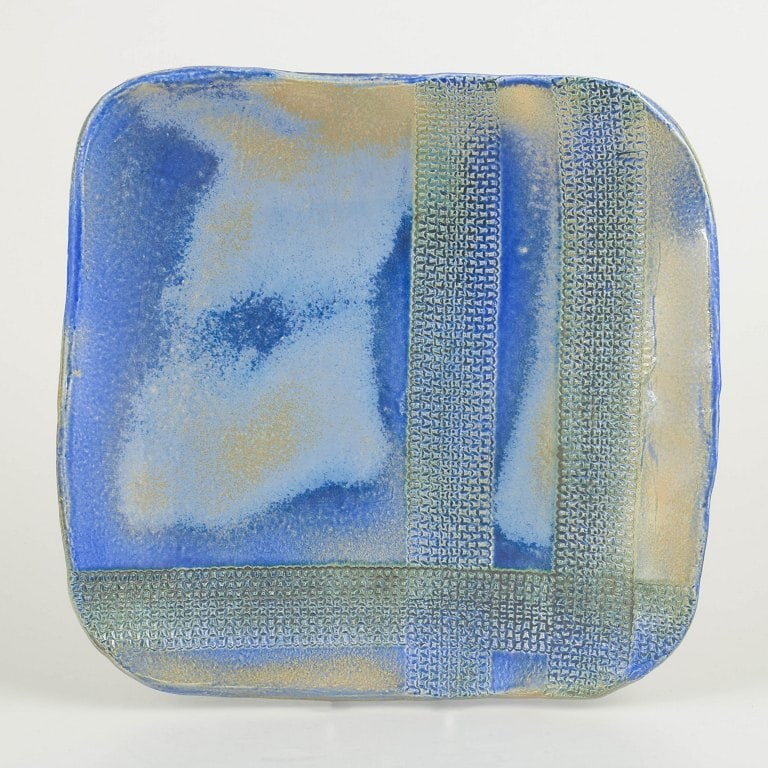 European Studio Potter. Large square stoneware wall dish with glaze in blue, green and golden tones.: European Studio Potter Large unique wall dish, 1980s. Handcrafted square wall dish in stoneware with experimental glaze in blue, green and golden tones. Decorated with relief textures and geometric fi