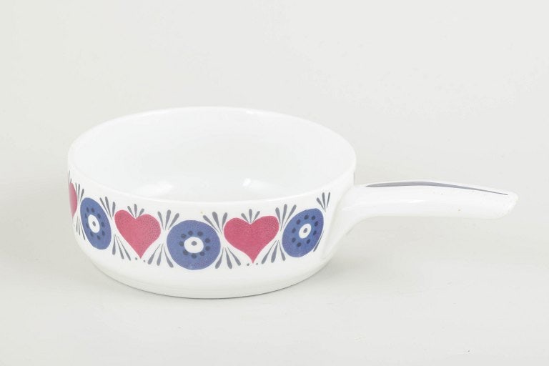 Marianne Westman for Rorstrand, Sweden. Stoneware casserole with floral motif. Approx. 1960s.: Marianne Westman for Rorstrand. Casserole, Silja model, 1960s. Decorated with Westman's iconic retro floral motif in blue and pink on a white ground. Made in Rorstrand's heat-resistant "El-Fast"