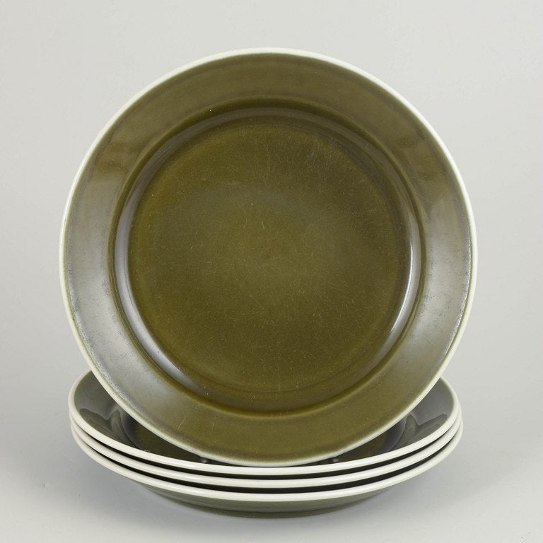 Stig Lindberg for Gustavsberg, Sweden. Set of four stoneware dinner plates with green glaze. approx. (1 of 4)