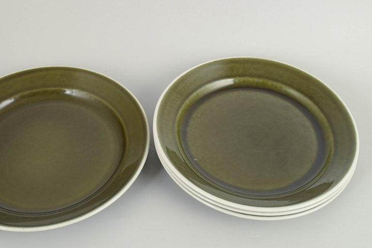 Stig Lindberg for Gustavsberg, Sweden. Set of four stoneware dinner plates with green glaze. approx. - 2