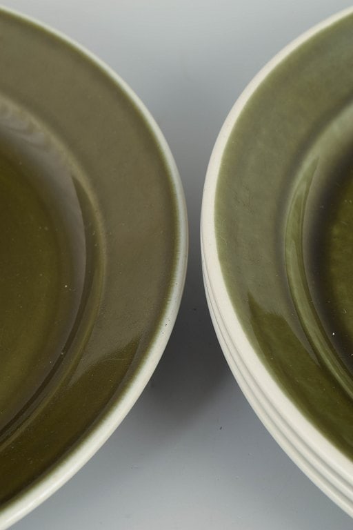 Stig Lindberg for Gustavsberg, Sweden. Set of four stoneware dinner plates with green glaze. approx. - 3