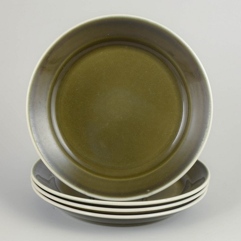 Stig Lindberg for Gustavsberg, Sweden. Set of four stoneware dinner plates with green glaze. approx. (1 of 4)