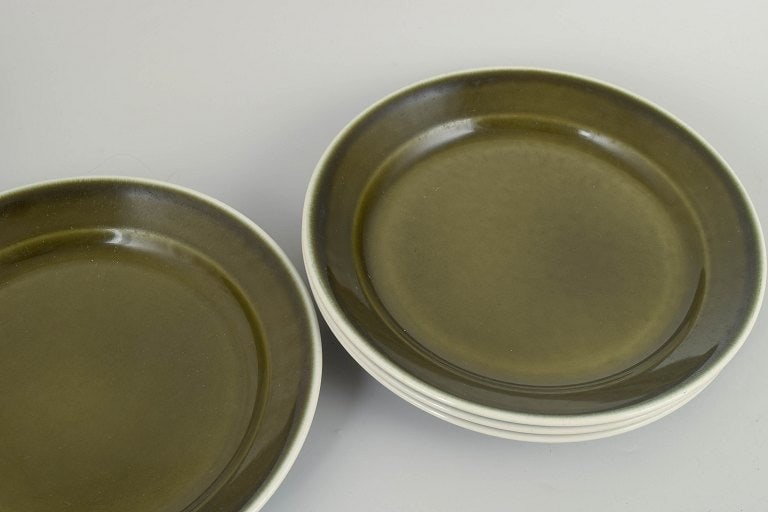 Stig Lindberg for Gustavsberg, Sweden. Set of four stoneware dinner plates with green glaze. approx. - 2