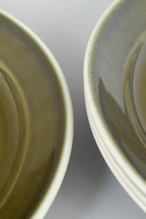 Stig Lindberg for Gustavsberg, Sweden. Set of four stoneware dinner plates with green glaze. approx. - 3