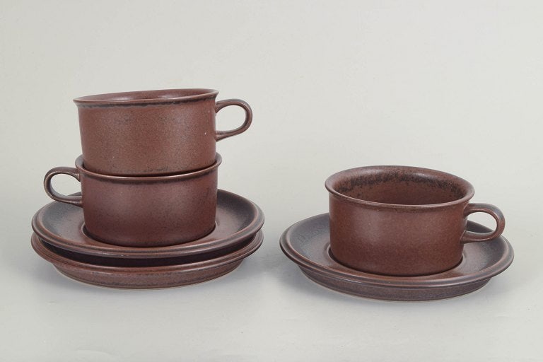Ulla Procope for Arabia, Finland. Ruska, set of three stoneware tea cups with matching saucers in: Ulla Procope for Arabia, Ruska tea cups with saucers, set of 3. Set of three stoneware tea cups with matching saucers from the Ruska series by Arabia. Finished in the distinctive mottled brown glaze i