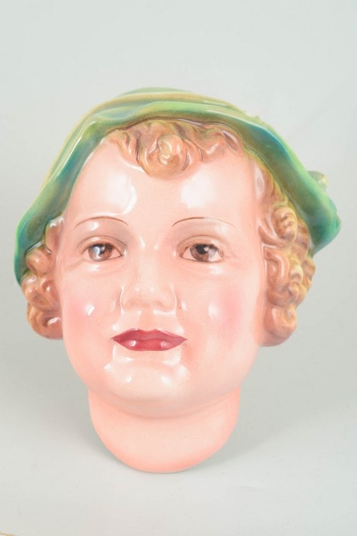 Keramos, Vienna, Austria. Art Deco wall mask in glazed ceramic. Circa 1930s.: Keramos, Vienna, wall mask. Art Deco wall mask in glazed ceramic modelled as a face; model "Padany", model no. 1694. Stamped "Wien Keramos" and "Made in Austria". Origin: Austria. Material: Ceramic. D