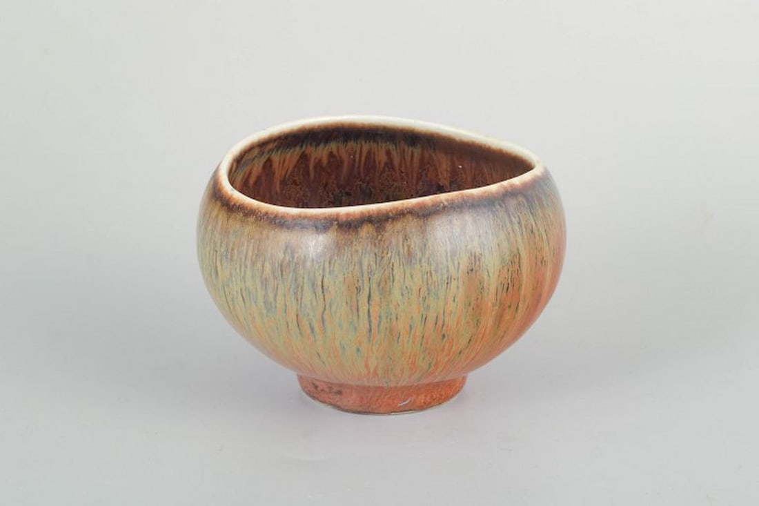 Gunnar Nylund for Rorstrand, Sweden. Organically shaped stoneware bowl with multicolored glaze.: Gunnar Nylund for Rorstrand Bowl, mid-20th century. Organically shaped stoneware bowl with multicolored glaze in green, pink, and brownish tones. Origin: Scandinavia. Designer: Gunnar Nylund