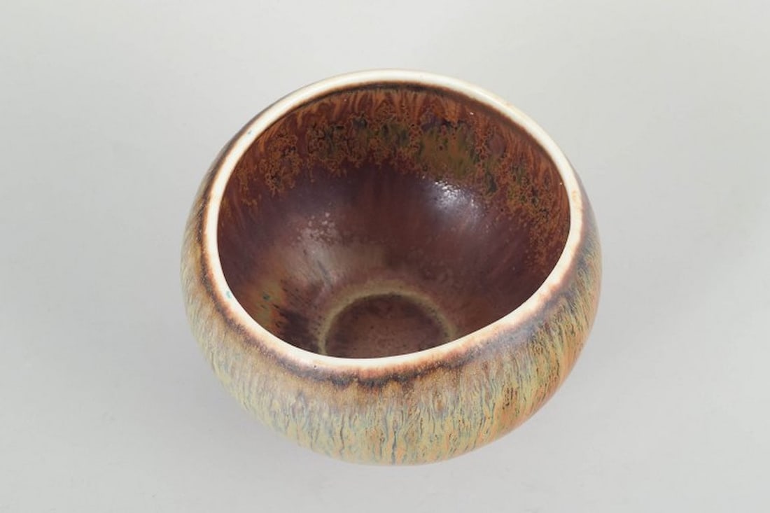 Gunnar Nylund for Rorstrand, Sweden. Organically shaped stoneware bowl with multicolored glaze. - 2