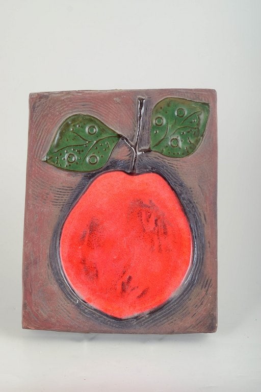 Ester Wallin for Upsala Ekeby, Sweden. Large ceramic wall relief with fruit motif. Approx. 1960s.: Ester Wallin for Upsala Ekeby, wall relief. Large and rare glazed ceramic wall relief with a stylised fruit motif. The composition is dominated by a bold red fruit form with green leaves set against a