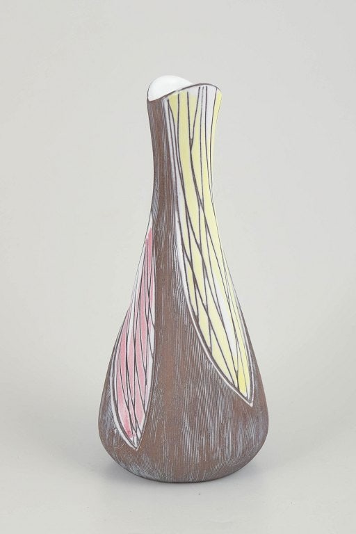 Mari Simmulson for Upsala Ekeby, Sweden. Slender figurative faience with colourful decoration. vase.: Mari Simmulson for Upsala Ekeby, vase. Slender figurative vase model 4417 with stylised decoration in brown, yellow, and pink glaze with incised linear patterning. Origin: Sweden. Designer: Mari Simmu