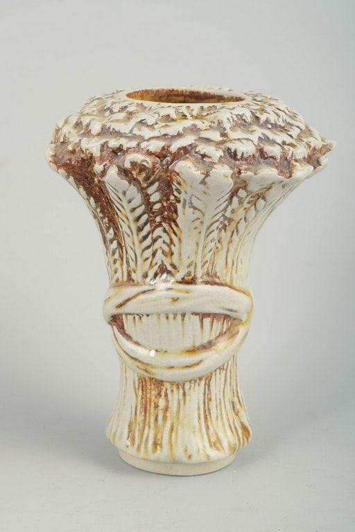 Hoganas, Scandinavia. Stoneware vase with relief decoration in cream and brown tones. Circa 1960s.: Hoganas, vase. Strongly modelled stoneware vase with pronounced relief decoration and a thick, flowing glaze in cream and brown tones. The surface has a distinctive, almost bark-like character that