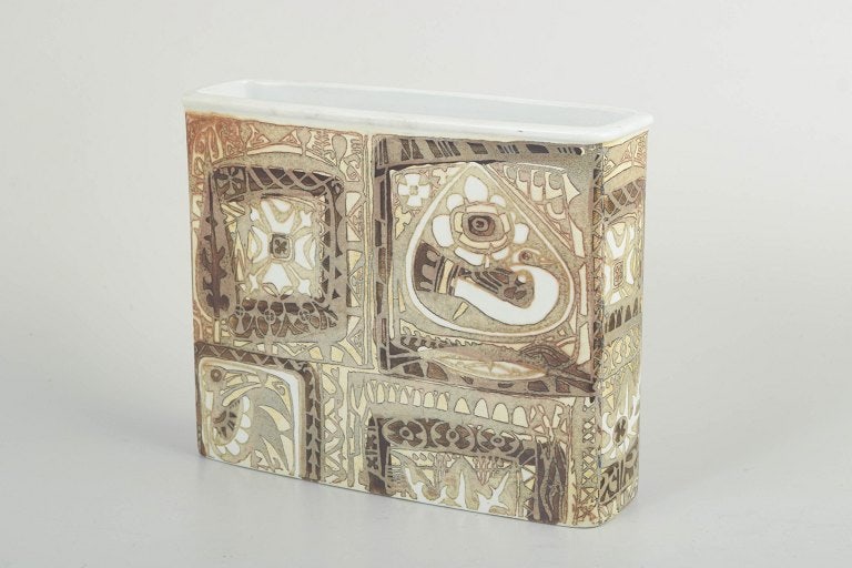 Nils Thorsson for Royal Copenhagen, Denmark. Rectangular faience vase with geometric ornamentation.: Nils Thorsson for Royal Copenhagen, vase. Rectangular faience vase with relief-decorated panels and characteristic geometric ornamentation in muted earth tones with lighter contrasting details. The