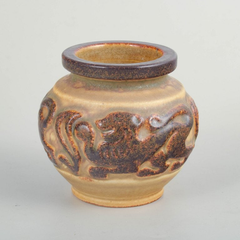 Michael Andersen & Son, Bornholm, Denmark. Rounded stoneware vase with relief decoration of an: Michael Andersen & Son, Bornholm, relief-decorated vase. Compact, rounded stoneware vase with moulded relief decoration featuring an animal and stylised foliage. Finished in warm, earthy glaze tones