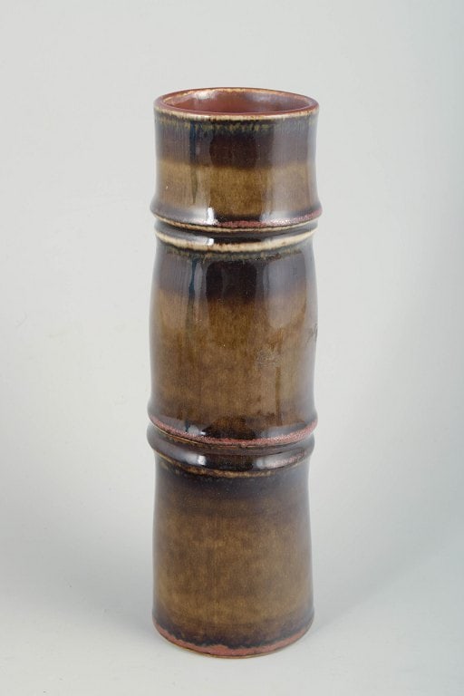 Olle Alberius for Rorstrand, Sweden. Tall, cylindrical stoneware vase in warm brown, amber, and (1 of 4)