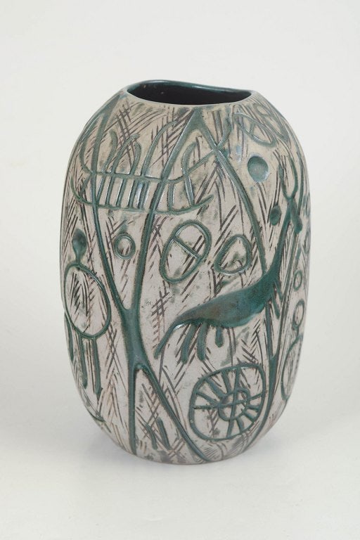 Mari Simmulson for Upsala Ekeby, Sweden. Stoneware vase with relief decoration in green and grey: Mari Simmulson for Upsala Ekeby, "Hedenhos" vase. Decorative stoneware vase with distinctive relief decoration in green and grey tones. The vase belongs to the Hedenhos series and is characterised by 