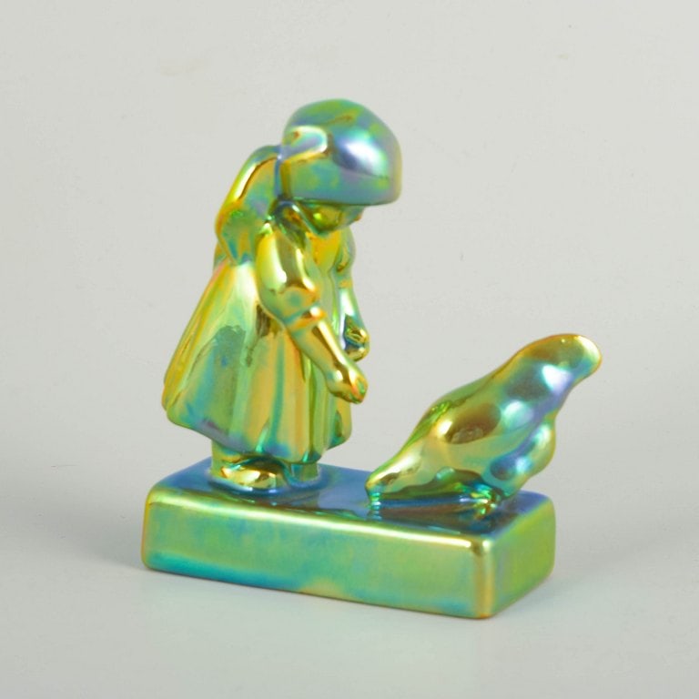 Zsolnay, Hungary. Faience girl with chicken in eosin glaze in green and golden tones. Approx. 1930s. - 2