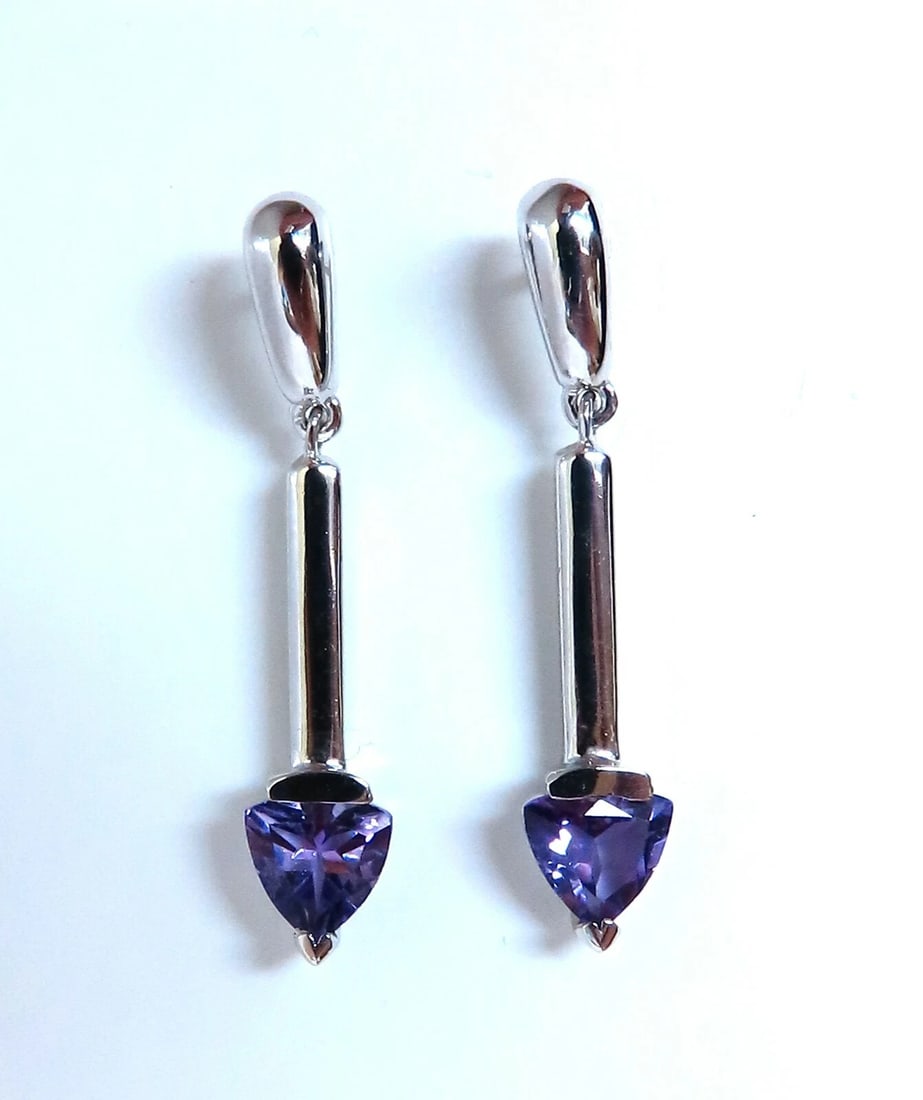 2ct Amethyst earrings 14kt**: Title: 2ct Amethyst earrings 14kt** Description: Natural Vivid Purple Amethyst Earrings. 2ct natural vivid purple amethyst. 5x5mm each 14 karat white gold 3.7 grams Overall earrings: 1.2 inch long ...