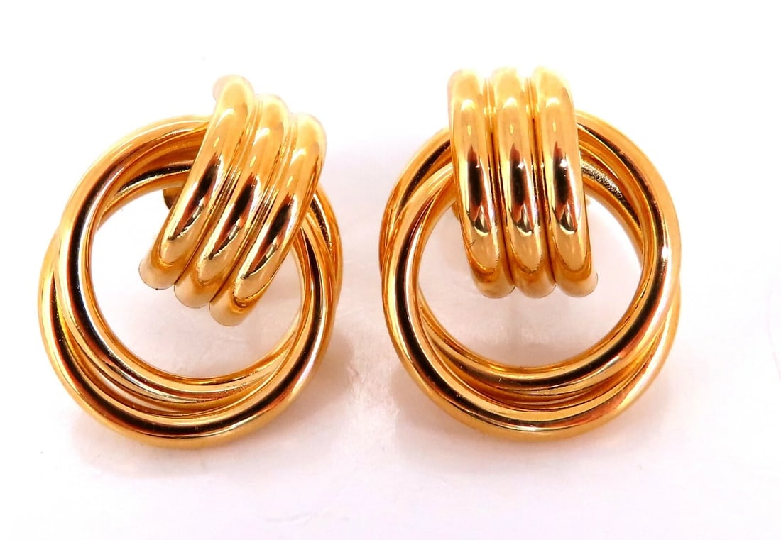 14kt Gold Circular Tube Earrings Knocker Classic**: Title: 14kt Gold Circular Tube Earrings Knocker Classic** Description: Double Loop Interlocking Tubular Knocker Textured Clip Earrings Measurements: 17 x 22mm Depth: 7mm Comfortable butterfly pierce 5