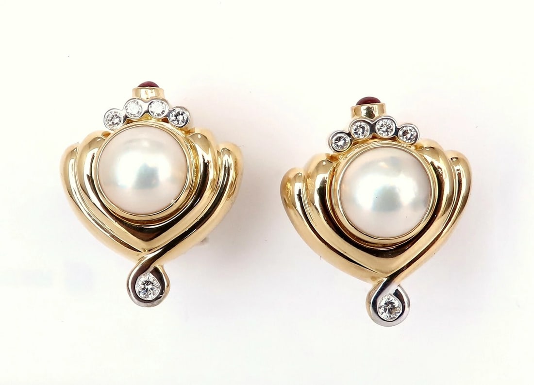 Lagos 11mm Mabe Pearls .60ct Diamonds Clip Earrings 18kt Gold**: Title: Lagos 11mm Mabe Pearls .60ct Diamonds Clip Earrings 18kt Gold** Description: Designer Lagos Statement mabe Pearl clip earrings. 11 mm Pearl Excellent AAA luster and Sheen. .60 carat natural dia