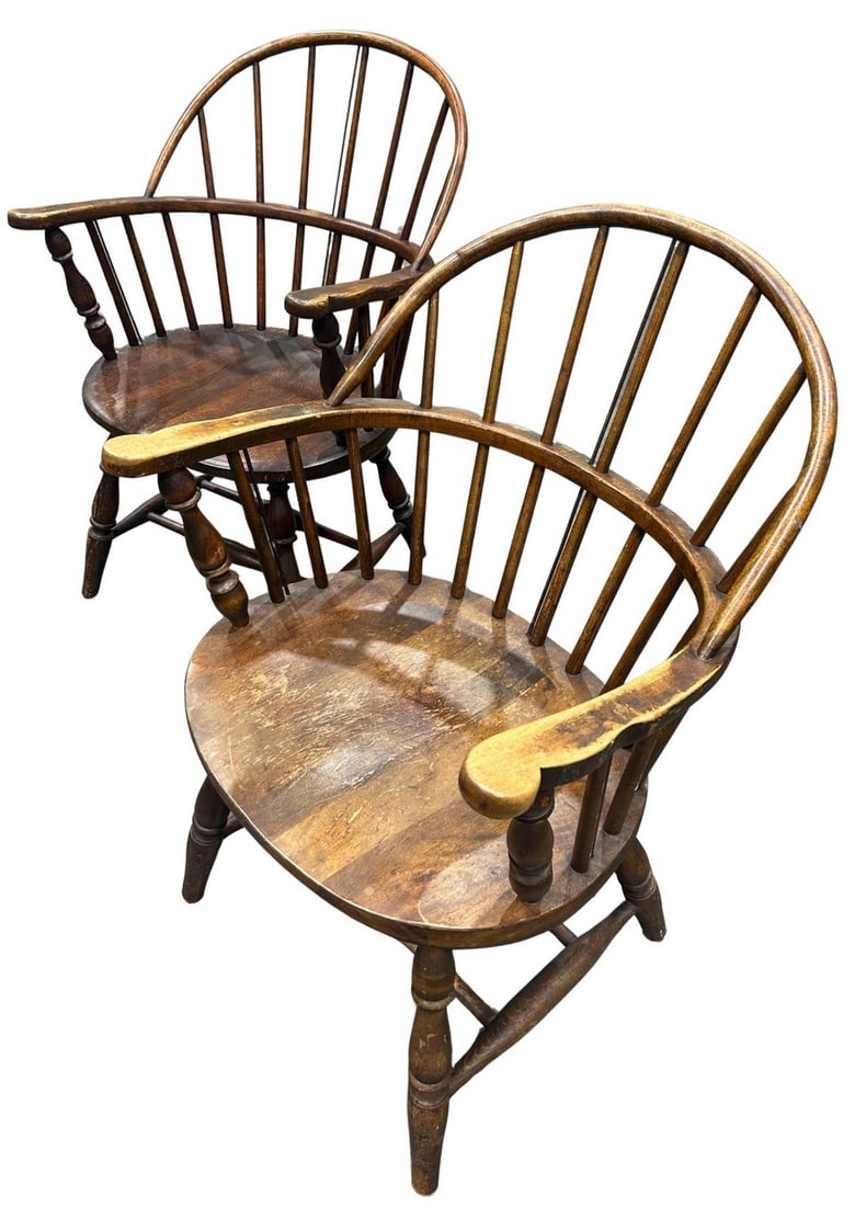 Pair of Bentwood and Spindle Back Chairs: A charming pair of bentwood and spindle back chairs, likely American, late 19th or early 20th century. Each chair features a curved bentwood frame forming the backrest and armrests, with multiple