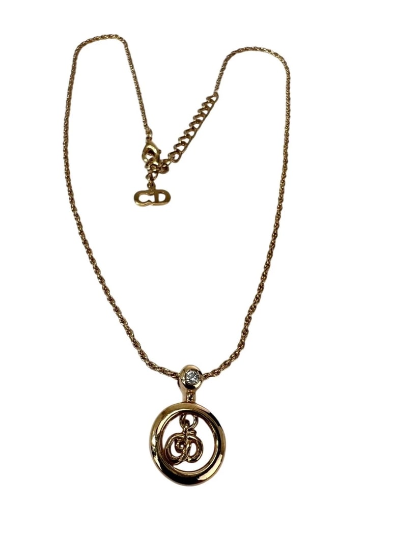 Christian Dior Round Crystal Pendant Charm Necklace: Title: Christian Dior Round Crystal Pendant Charm Necklace Description: Preowned 100% Authentic Christian Dior Crystal Round Pendant Necklace RATING: A...excellent, near mint, has little to no signs o