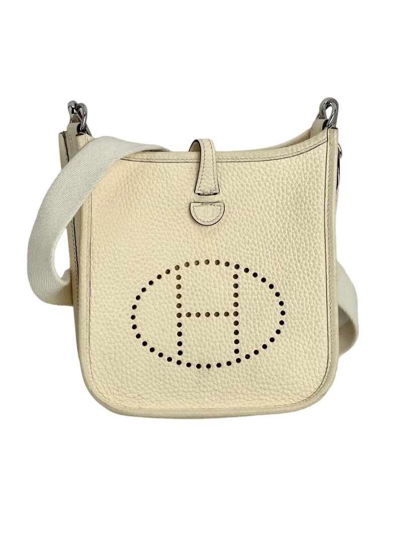 Hermes Taurillon Clemence evelyne TPM Nata White Crossbody Bag: Title: Hermes Taurillon Clemence evelyne TPM Nata White Crossbody Bag Description: Pre-Owned 100% Authentic Hermes Taurillon Clemence evelyne TPM Nata White Crossbody Bag RATING: B...Very Good, well m