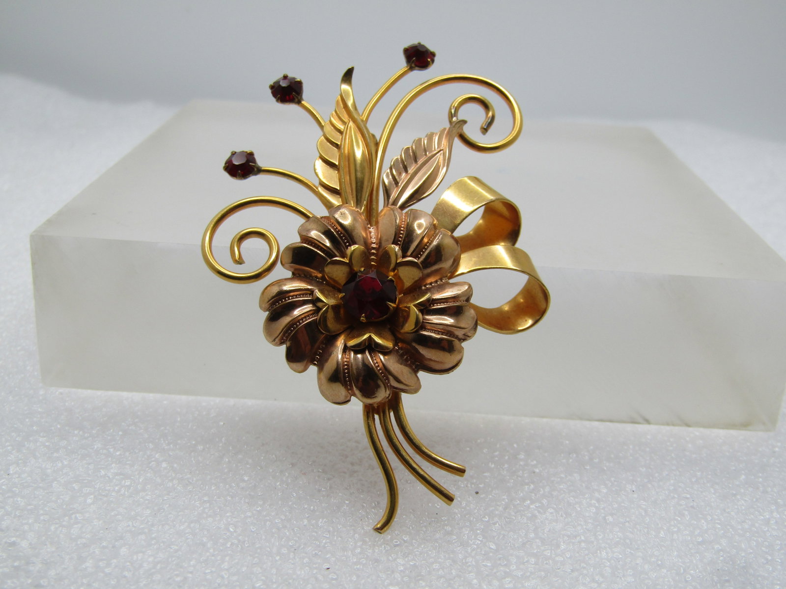 Vintage 12kt GF Floral Brooch, Red Rhienstones, 1940's: Title: Vintage 12kt GF Floral Brooch, Red Rhienstones, 1940's Description: Vintage 12kt GF Floral Brooch, Red Rhienstones, 1940's. Yello gold filled blossom bouquet style brooch with curled accents, l