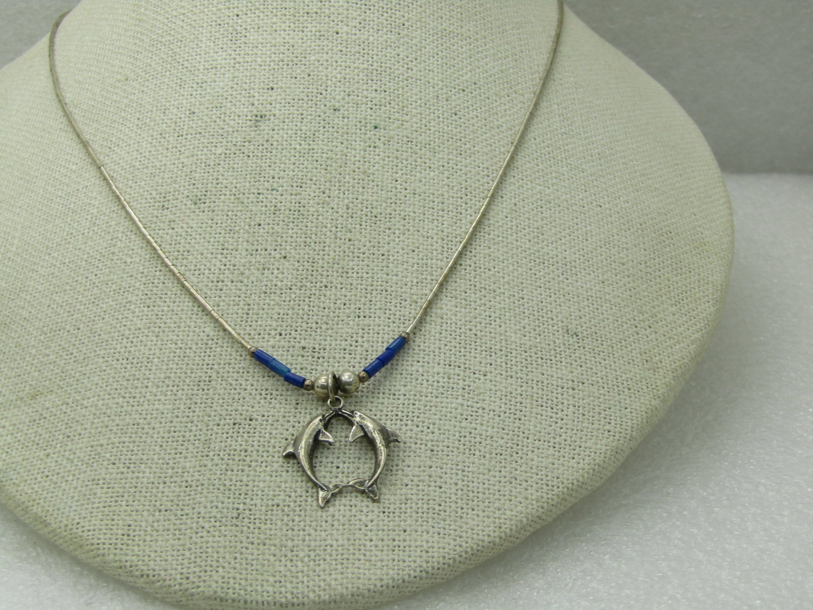 Vintage Sterling Dolphins Lapis Lazuli Necklace, 18": Title: Vintage Sterling Dolphins Lapis Lazuli Necklace, 18" Description: Vintage Sterling Dolphins Lapis Lazuli Necklace, 18", appx. 3.83 grams. Signed with a mark that cannot be read, marked sterling