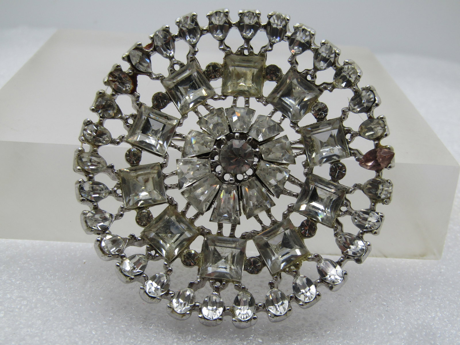 Vintage Rhinestone Round Brooch, 1950's-1960's: Title: Vintage Rhinestone Round Brooch, 1950's-1960's Description: Vintage Rhinestone Round Brooch, 1950's-1960's. Large wheel shaped brooch with open areas around the stones. Marquise on the edge tha